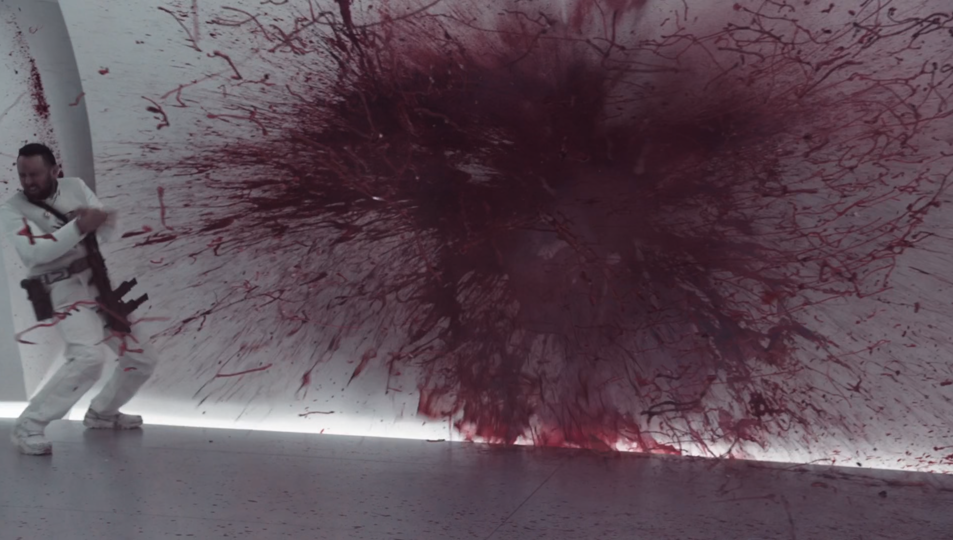The meme is a screenshot from the movie "The Matrix" where a character, Agent, is shot in the head and his body explodes in a cloud of blood and gore. The image is captioned "When you finally get a raise but your boss still finds a way to make you feel like a bullet to the head".